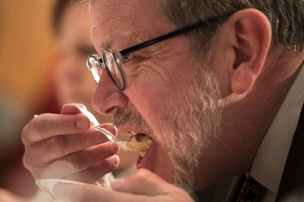 Eric Kaler tastes an entry during the hotdish competition