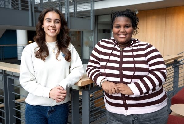 two young women posing for a portrait