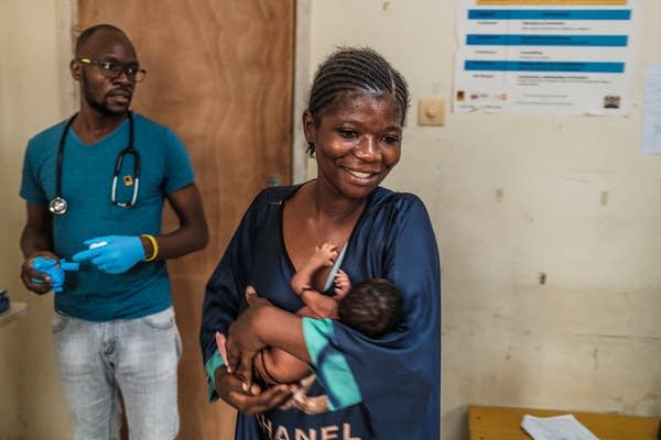 woman holding her baby