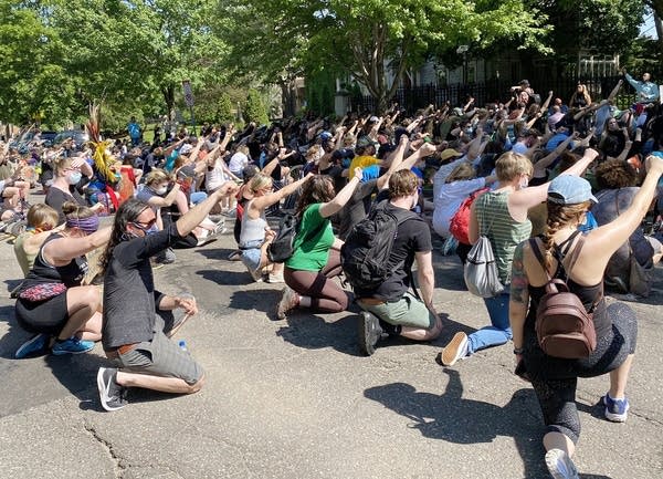 Kneeling protestors at the governors residence