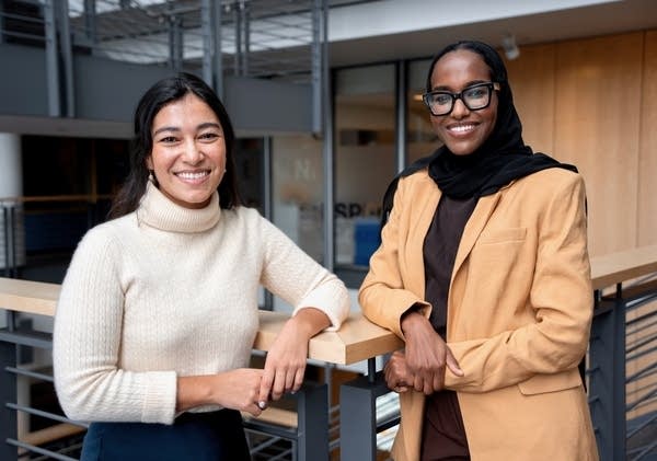 two women posing for a portrait