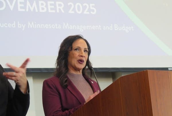 People speak at a podium