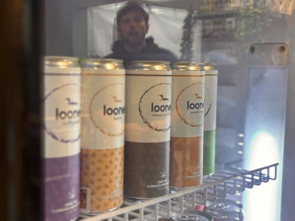 Cans of Looner seltzer sit in a refrigerator.