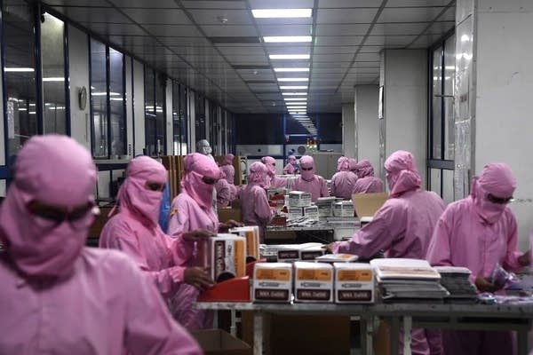 In this photograph taken on September 2, 2020, workers pack syringes at the Hindustan Syringes factory in Faridabad. - India's biggest syringe manufacturer is ramping up its production to churn out a billion units, anticipating a surge in demand as the global race to find a COVID-19 coronavirus vaccine heats up. (Photo by SAJJAD HUSSAIN / AFP) (Photo by SAJJAD HUSSAIN/AFP via Getty Images)