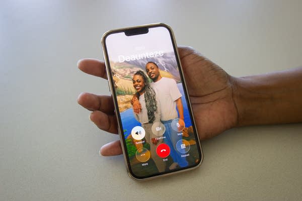 A person holding a phone and showing an image