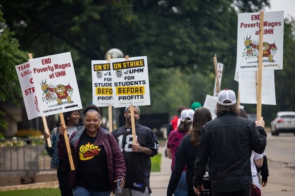 People walk a picket line