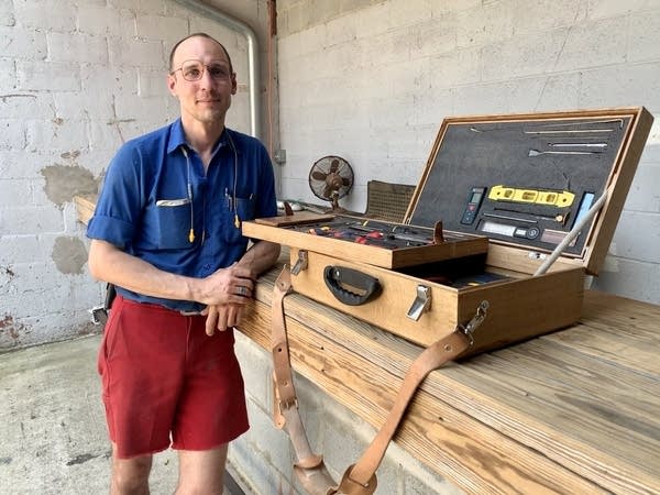 Carpenter Josh Dean chose vintage wood to build an extension for an outdoor bar at a local restaurant. The existing bar (pictured) was built with new lumber.