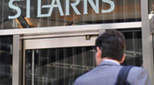 A Bear Stearns employee enters company headquarters.
