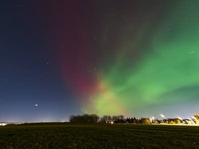 Red and green lights in the night sky