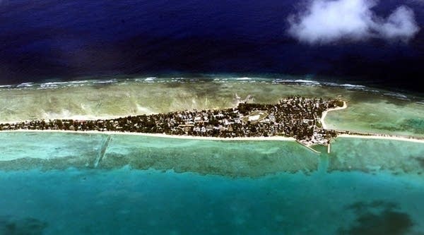Tarawa atoll, capital of the archipelago nation of Kiribati, in 2001. The islands are expected to be mostly submerged within 100 years.
