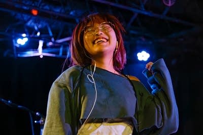 Babebee smiling on stage