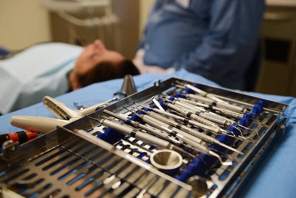 Dental utensils in the dental clinic, plus patient