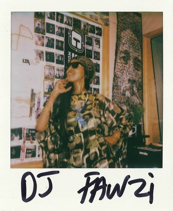 DJ Fawzi posing for a polaroid photo