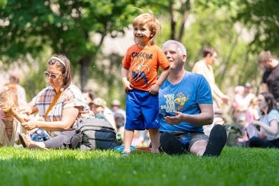 kids and their parents having fun at an outdoor event
