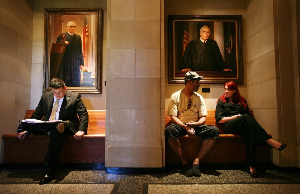 Waiting to enter the courtroom