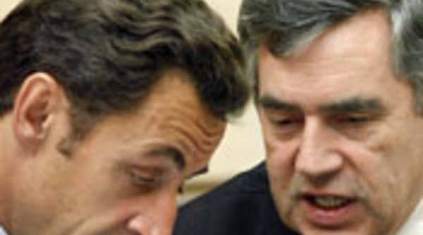 France's President and current European Union president Nicolas Sarkozy talks with Britain's Prime minister Gordon Brown before financial crisis summit with Eurogroup heads of state and government European Commission at the Elysee Palace in Paris Oct. 12, 2008.