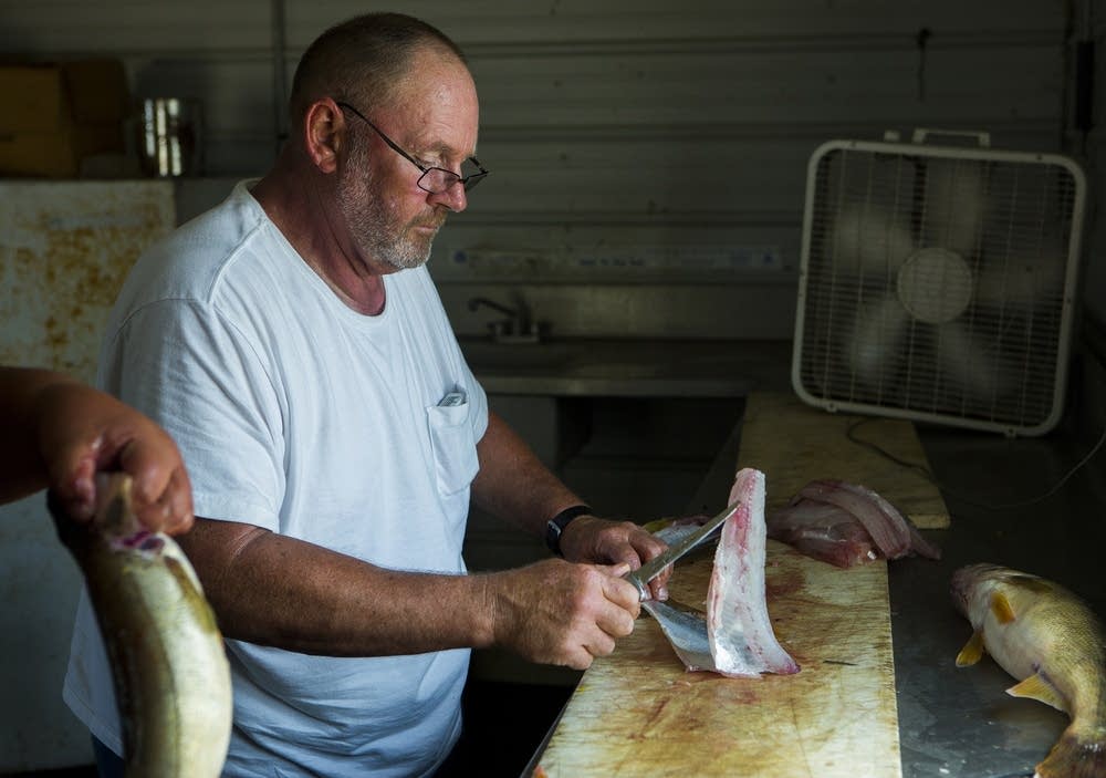 Pat Rooney cleaned a walleye.