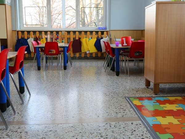 inside of a classroom in kindergarten with small chairs