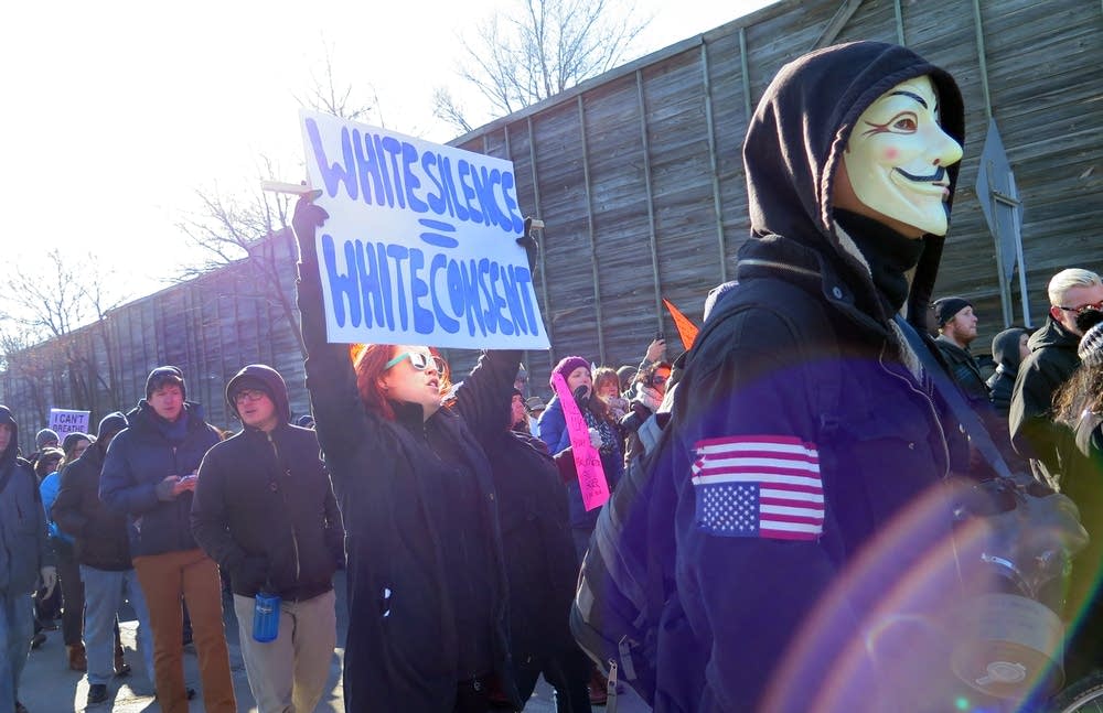 Protesters march down I-35W ramp.