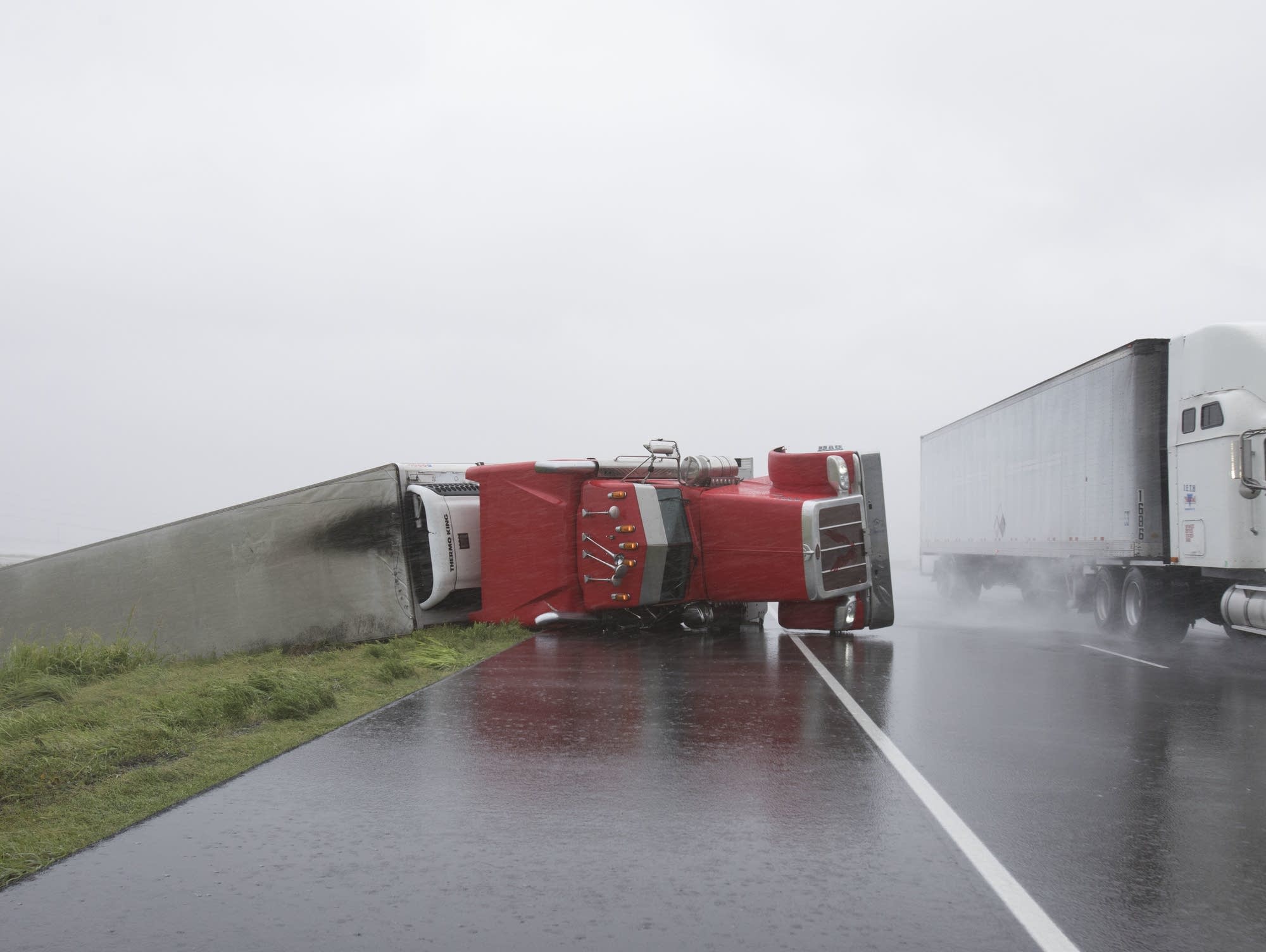 A big rig lies on it's side on Hwy 59 near Edna, Texas
