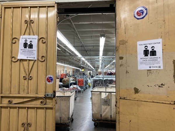 Workers turn cut pieces of fabric into garments inside an old building in downtown Los Angeles.