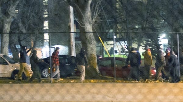 Scarsella and three other men, left, at a protest outside the 4th Precinct.