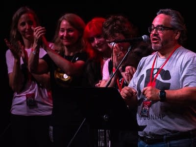 A man speaks into a microphone.