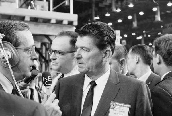 California Gov. Ronald Reagan speaks to journalist John Chancellor on the floor of the Republican National Convention, Miami Beach, Florida, in August 1968. 