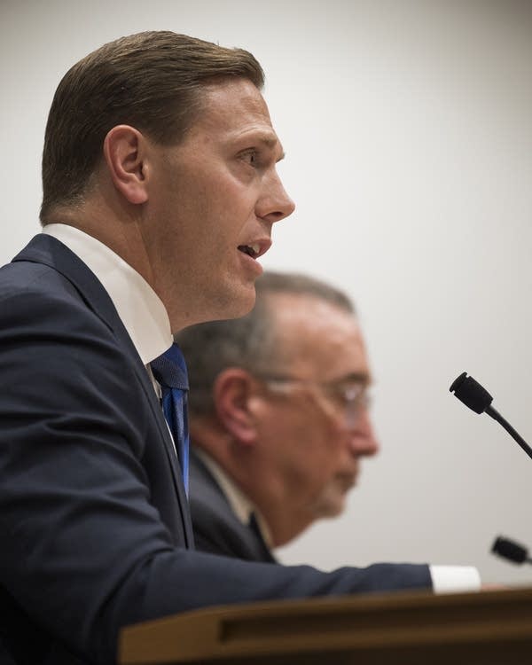 Two person testify during a hearing