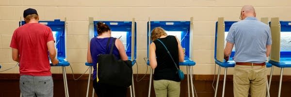 four people voting