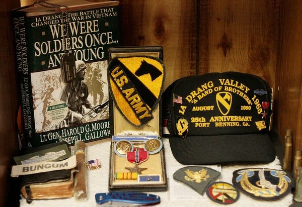 Memorabilia sits inside a cabinet.