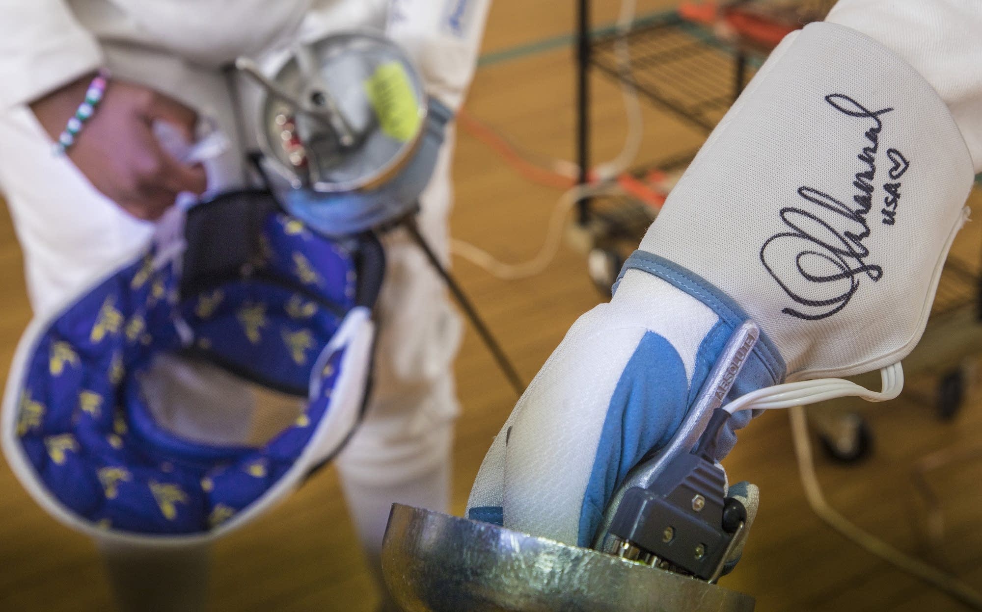 Fencing students have had their gloves signed by professional fencers.
