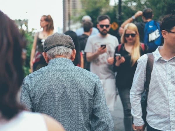 Older man in a crowd