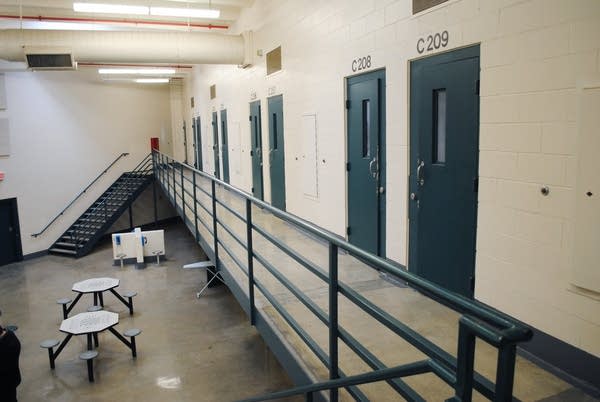 A view of doors and tables at a prison.