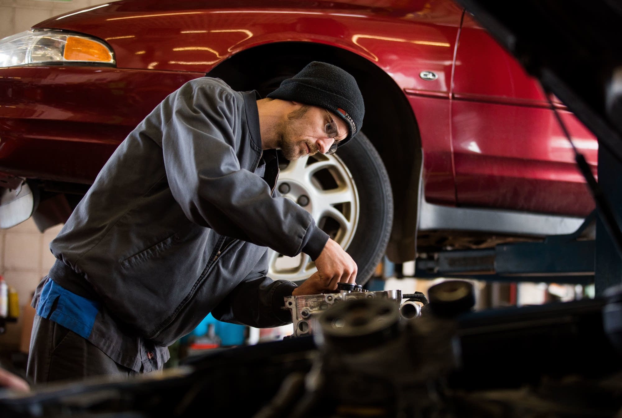 Mechanic Mike Pinor works on an engine Monday, May 21, 2018.