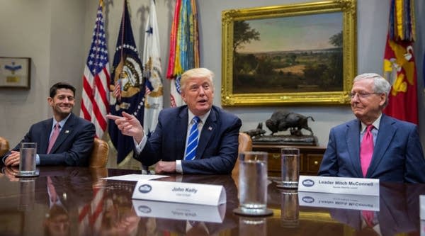 President Donald Trump with Speaker of the House Paul Ryan (L) and Senate Majority Leader Mitch McConnell (R), delivers remarks during a meeting with members of Congress and his administration regarding tax reform in the Roosevelt Room of the White House on September 5, 2017 in Washington, DC.