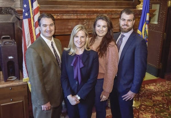 Four people pose for a photo