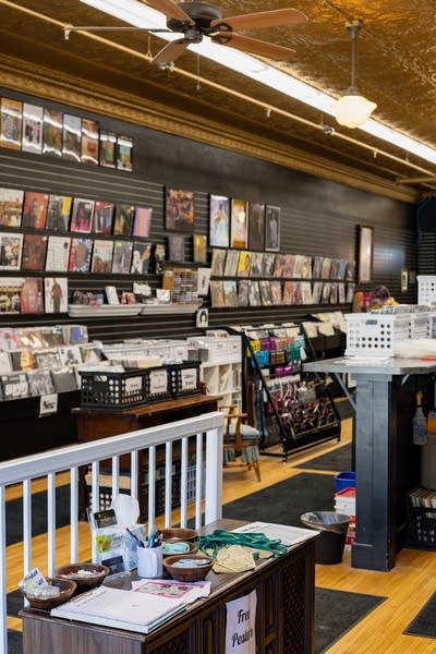 Shelves of records and CDs on display in a record store