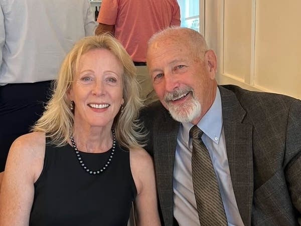 Two people pose for a photograph.