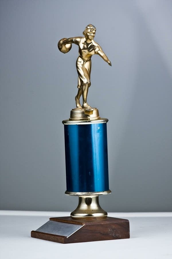 Smallish Bowling Trophy, blue base with statuette of bowler on top