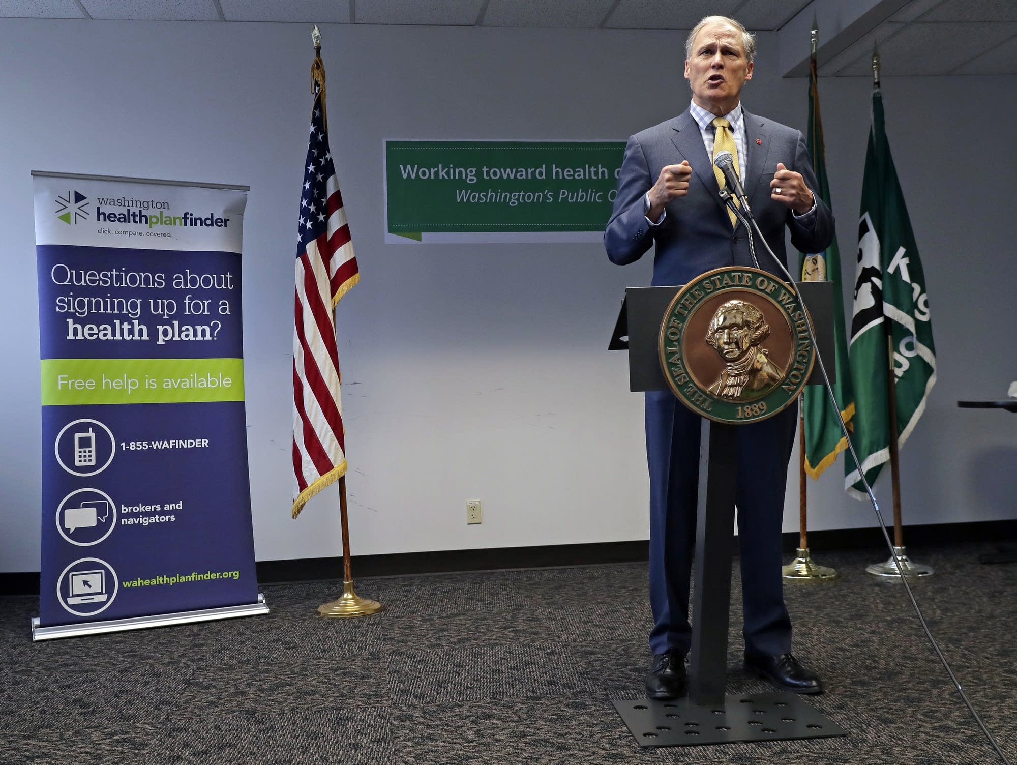 Washington Gov. Jay Inslee answers questions from reporters