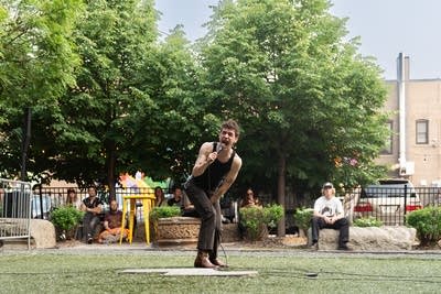 Nat Harvie performing music outdoors