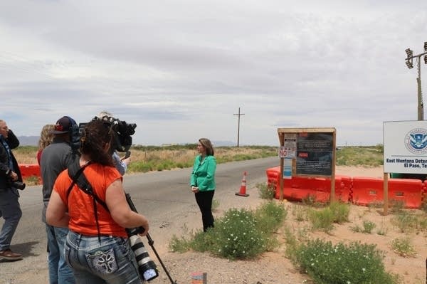 Rep. Craig stands near detention center