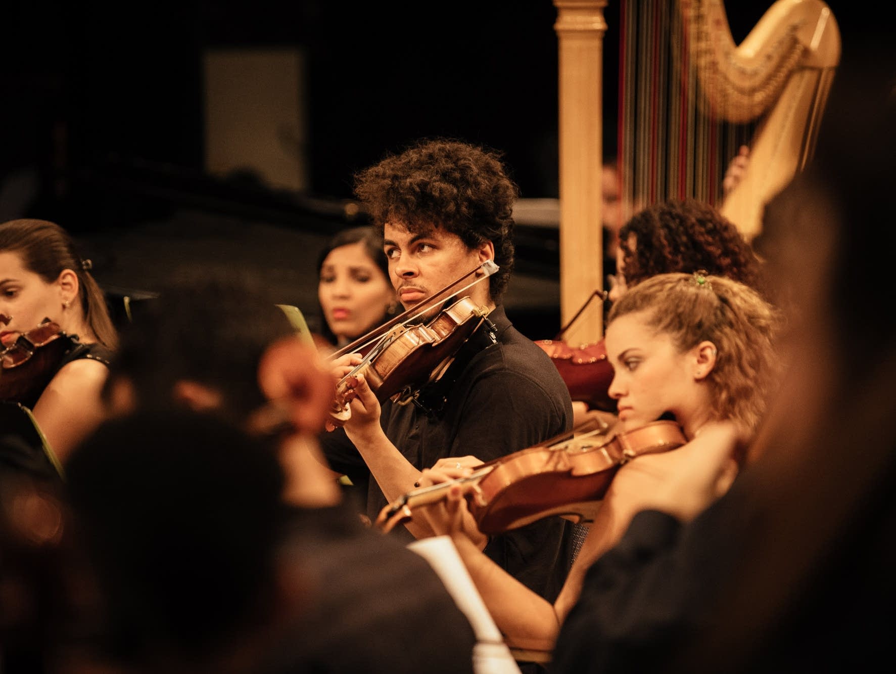 Violinists during CAYO's final performance