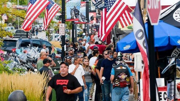 People stroll along Main Street on Thursday, the day before the start of the annual Sturgis Mortorcycle Rally.