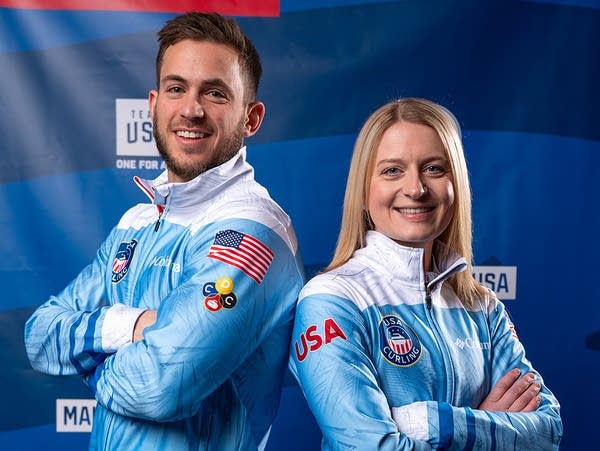 Two curlers pose for a photo