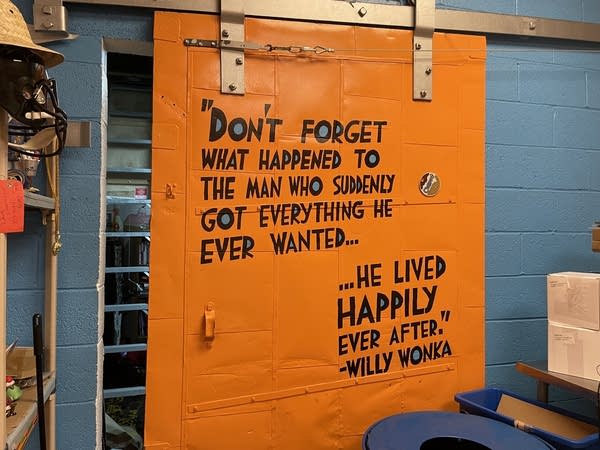 A quote from Willy Wonka is painted on an orange sliding door at an ice cream factory in Baltimore. 