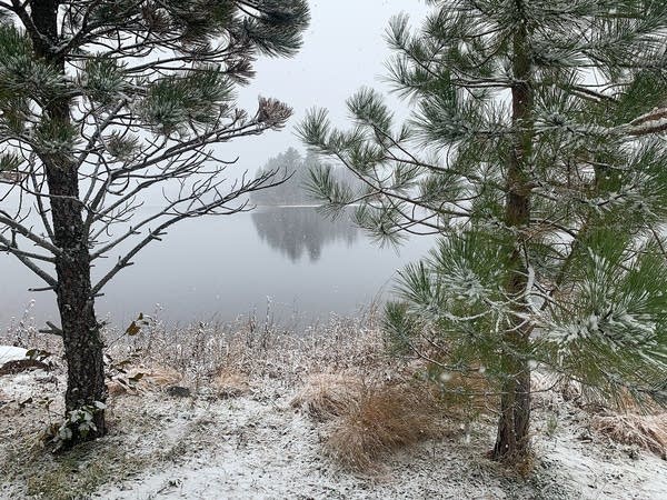 Cold and windy Saturday, with morning flake chances