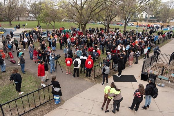 A group gathers in a park.