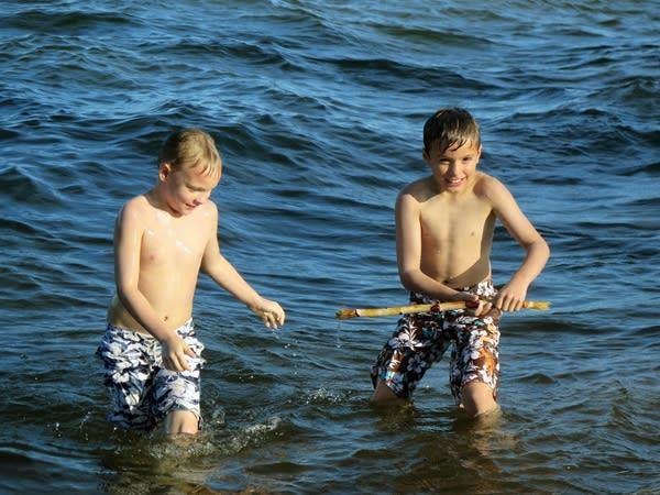 Landon and Gage Jones play in Lake Superior.